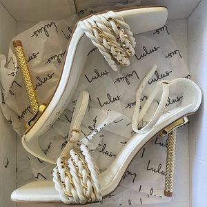 Brand new lulus white and gold strapped heels. Gorgeous gold statement heel.